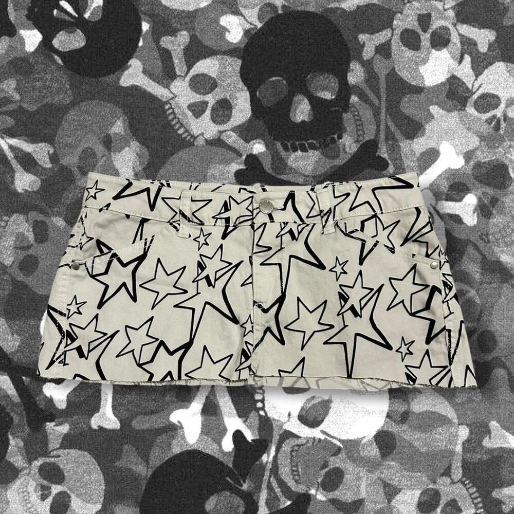 Y2K black allover star print white low rise micro mini skirt with raw cut hem
